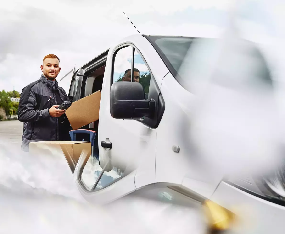 male wearing glasses getting out of a truck.
