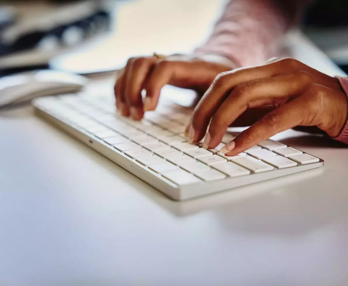 Close up typing on a keyboard of a computer